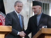 U.S. President George W. Bush (left) and Afghan President Hamid Karzai after a press conference at the Presidential Palace in Kabul, March 1 (AFP)