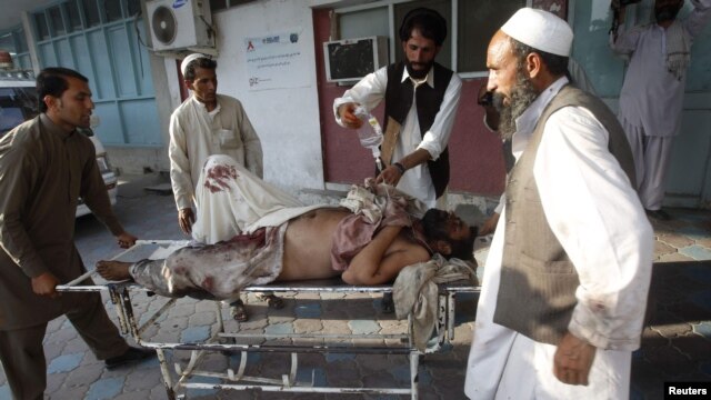 A man injured in the September 4 bomb blast is wheeled into a hospital in Jalalabad.