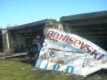 A reporter poses outside the crumbling soccer stadium in Masalli 