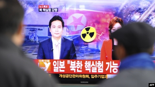 Passengers at a train station in Seoul, the capital of South Korea, watch TV news reporting North Korea's nuclear test.