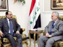 Prime Minister al-Maliki (left) speaking with Vice President al-Hashimi on May 10(epa)