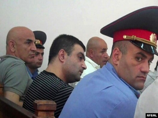 Armenia -- Gagik Matevosian (C) and other men accused of plotting to assassinate State Revenue Committee chief Gagik Khachatrian at the start of their trial, 8July 2010.