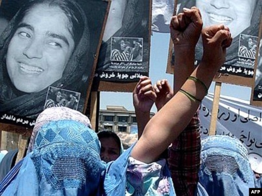 Afghan women take part in a demonstration against the national parliament's removal of outspoken female legislator Malalai Joya in May 2007.