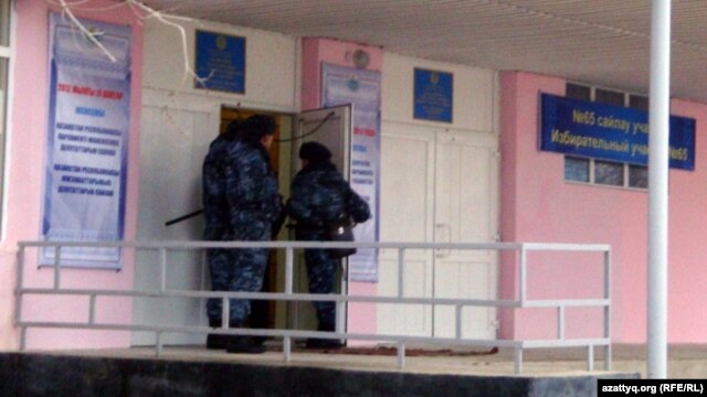 Security forces at a polling station in Zhanaozen in mid-January voting, in the wake of the previous month's deadly clashes
