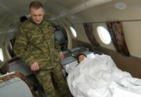 Andrei Sychyov being flown to a military hospital in February (ITAR-TASS)