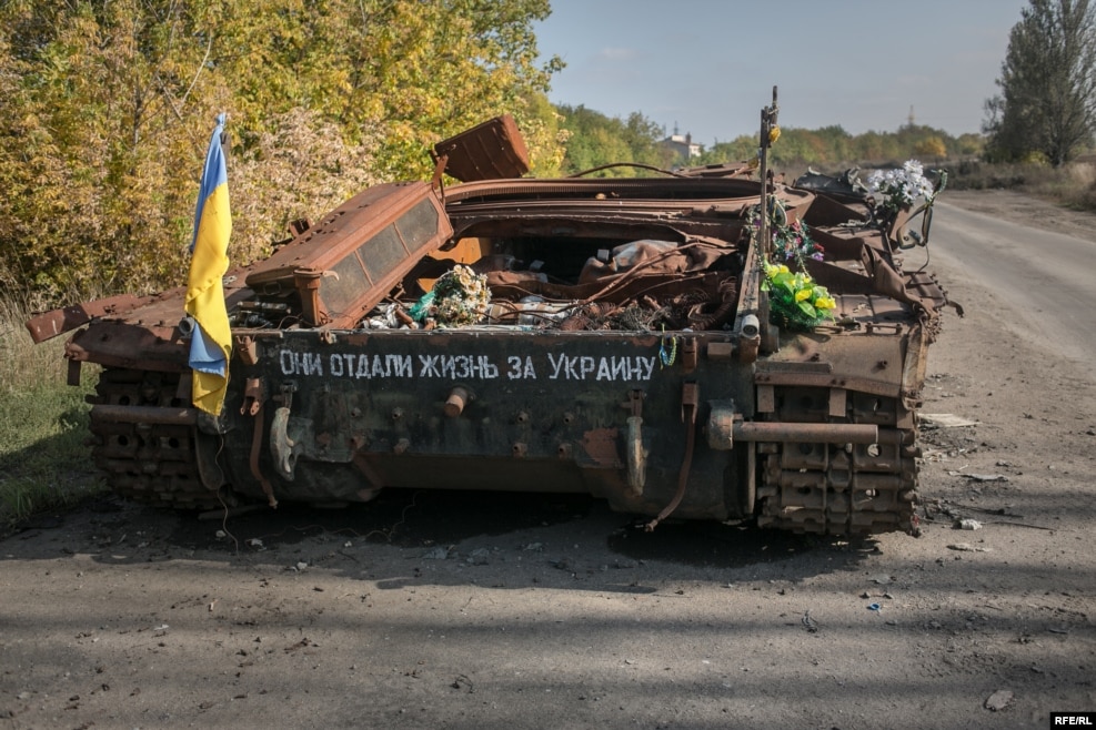 A destroyed Ukrainian tank on the road leading to the war-torn town of Pisky. The writing on the tank reads "they gave their lives for Ukraine." Pisky was once a wealthy suburb of Donetsk, but has been completely devastated by the war.
