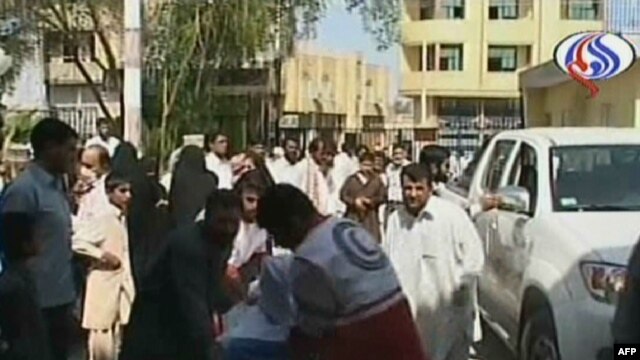 A wounded man arrives at a hospital in the southeastern Iranian city of Pishin on October 18. A total of 42 people were killed in the attacks.