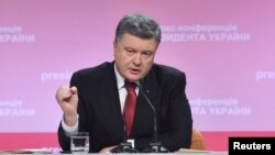 Ukrainian President Petro Poroshenko speaks during a news conference in Kyiv on December 29.
