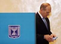 Acting Israeli Prime Minister Ehud Olmert voting on March 28 (epa)