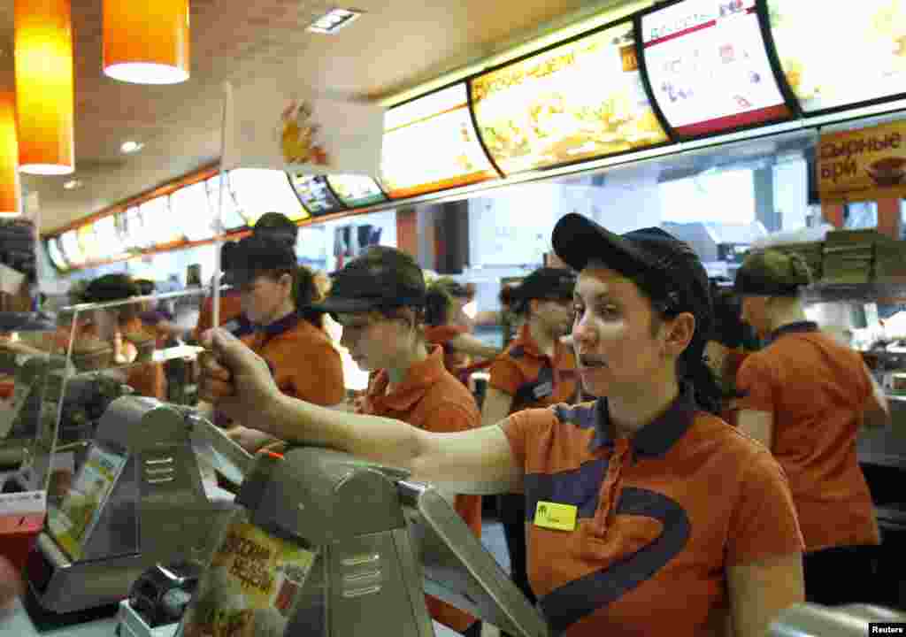 Staff attend to customers at a McDonald's restaurant in Moscow.