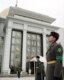 Soldiers stand guard outside the Ashgabat presidential palace where Niyazov\'s body was lying in state (AFP)