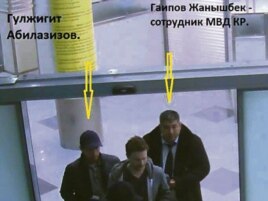 Гульжигит Абилазизов в сопровождении сотрудников МВД.