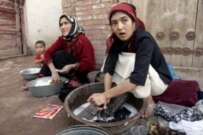 Uyghur women washing clothes in China's Xinjiang Uyghur Autonomous Region (epa file photo)