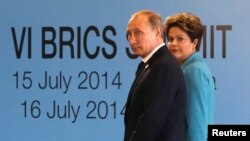 Brazilian President Dilma Rousseff (right) walks with Russian President Vladimir Putin before the sixth BRICS summit in Fortaleza, Brazil, on July 15.
