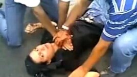 A screen grab from the YouTube video appearing to show men attending to Neda in Tehran on June 20.