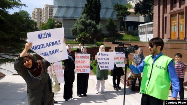Relatives of arrested Islamic Party activists protested in front of the president's offices in Baku in June. The crackdown on the party has since intensified.