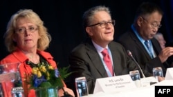 Swedish Environment Minister Lena Ek (left to right), and Thomas Stocker and Qin Dahe of the IPCC working group attend a meeting of the Intergovernmental Panel on Climate Change (IPCC) in Stockholm, Sweden, on September 23.