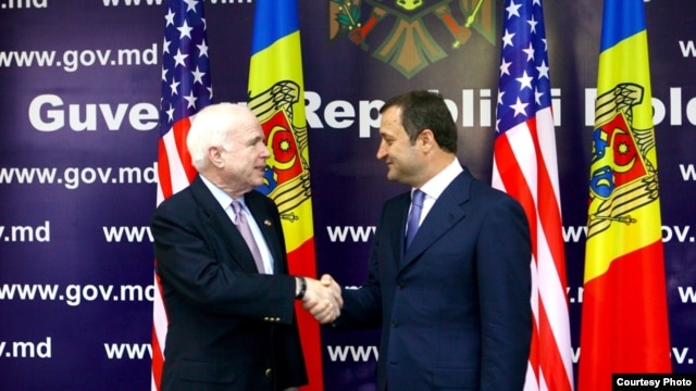 U.S. Senator John McCain (left) and Moldovan Prime Minister Vlad Filat meet in Chisinau.