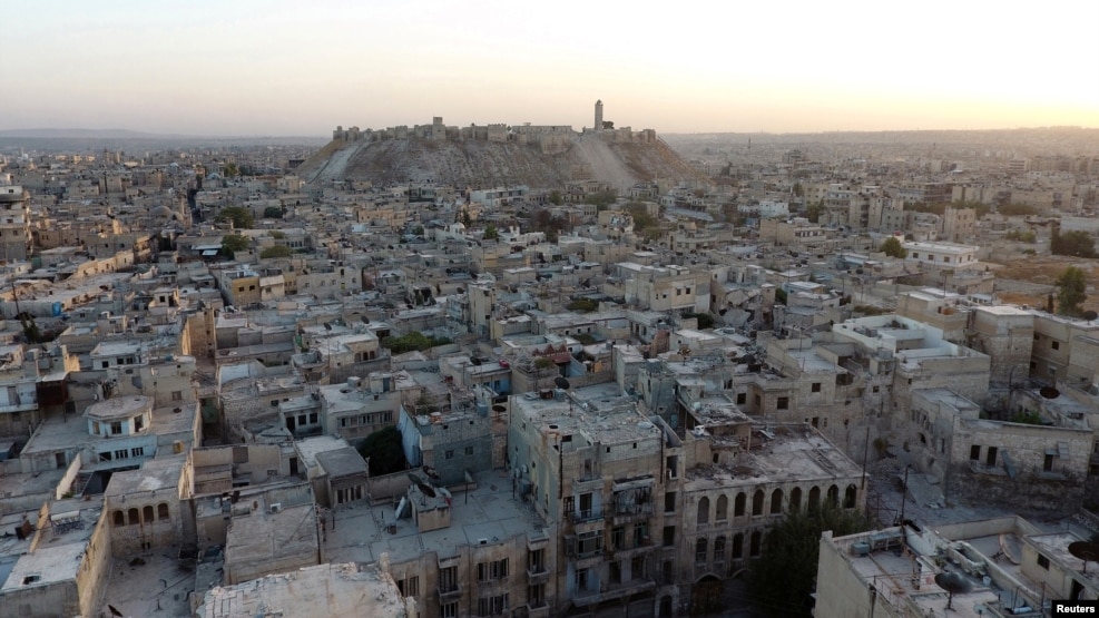 After talks with the German and Russian leaders in Berlin, French President Francois Hollande said, "What is happening in Aleppo is a war crime."