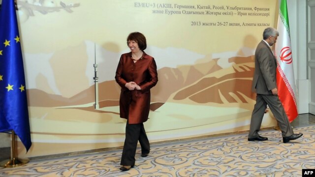 EU foreign-policy chief Catherine Ashton (left) and Iran's top nuclear negotiator, Said Jalili, walk away after meeting on the sidelines of the Almaty talks on February 26.