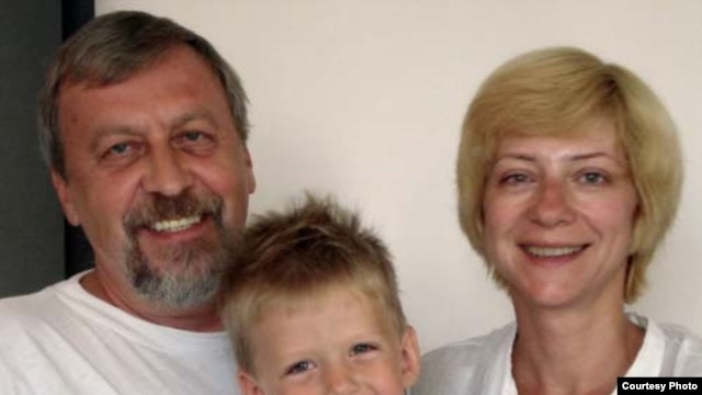 Iryna Khalip (right) with jailed husband Andrey Sannikau and their son Daniil. 