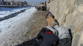Drug addicts use heroin and other narcotics near the Kabul River in the capital.