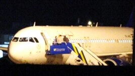 The Syrian passenger plane is seen after it was forced to land at Ankara airport on October 10.
