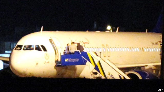 The Syrian passenger plane is seen after it was forced to land at Ankara airport on October 10.