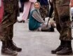 A Muslim refugee from Srebrenica takes part in a demonstration near Sarajevo