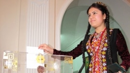 A woman casts her ballot at a polling station in Ashgabat.
