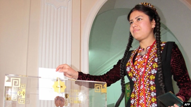 A woman casts her ballot at a polling station in Ashgabat.