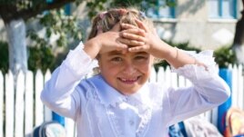 Moldova - Bursuc school, girl in the first form, 18Sep2009