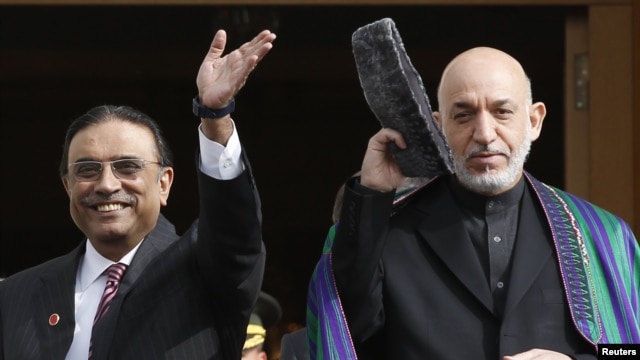 Pakistani President Asif Ali Zardari (left) told his Afghan counterpart, Hamid Karzai, that Pakistan was committed "to concrete action to eradicate the menace of terrorism and extremism."