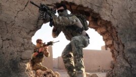 President Barack Obama says soldiers still face "tough fight" in Afghanistan.