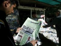 A man in Baghdad reading newspaper accounts of the events in Lebanon today (epa)