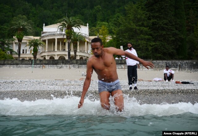 Samaliland player Abbikarim Hirsi takes a dip in the Black Sea on his first trip away from his homeland.