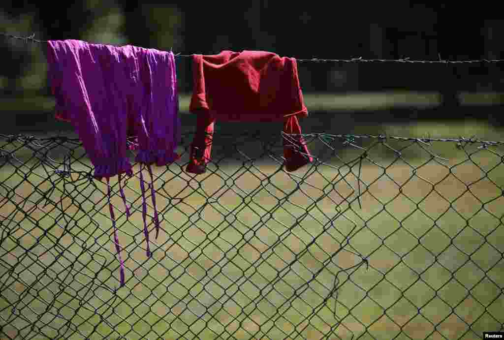 Clothes are hung up to dry on a fence at the Bogovadja asylum center. 