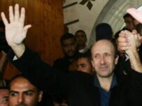 Johnston waves to supporters in Gaza City after his release today (AFP)