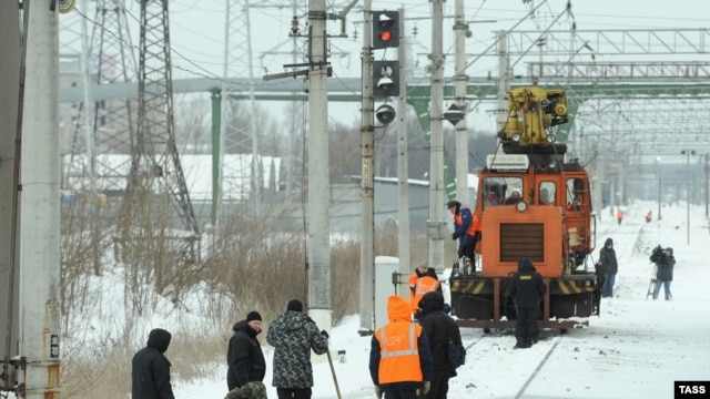 Investigators at the site of the blast on a railway line  near Russia's second-largest city, St. Petersburg, on February 2..