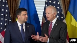 U.S. Vice President Joe Biden (right) speaks with Ukrainian Prime Minister Volodymyr Hroysman during the latter's visit to Washington this week.