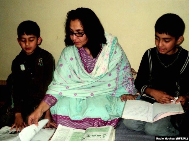 Shazma Haleem helping her sons, Mashaal and Abdaal, with their studies.