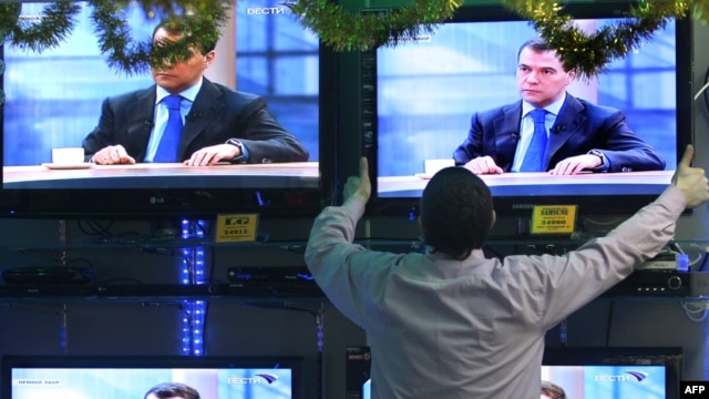 Televisions in a Moscow shop showing an interview with Russian President Dmitry Medvedev in December 2009.