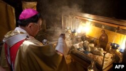 Christian pilgrims gather for Christmas midnight mass in the West Bank city of Bethlehem on December 24.