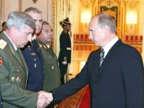 Putin greeting military officers at the Kremlin today (ITAR-TASS)