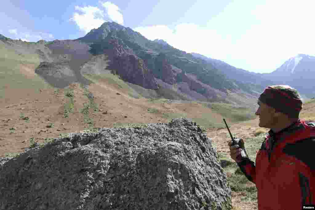 An alpinist prepares to climb Vladimir Putin Peak, whose naming has inspired some controversy within Kyrgyzstan.