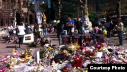 An impromptu memorial on the streets of Boston to victims of a bomb attack on the city's annual marathon in April, which killed three and injured hundreds.