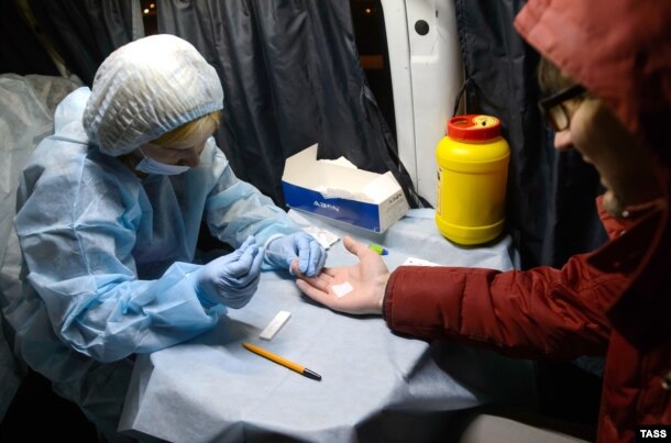 A man takes a blood test at a mobile HIV testing unit in Yekaterinburg earlier this month.