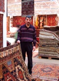 Carpet dealer Fahri shows Caucasian carpets at Domotex (RFE/RL)