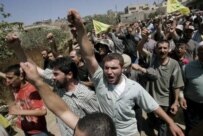 Lebanese civilians on August 17 attending the funeral of a Hizballah fighter killed during the recent fighting with Israel (epa)