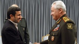 Iranian President Mahmud Ahmadinejad (left) meets with Azerbaijan Defense Minister General Safar Abiyev earlier this week. 